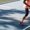 a woman playing pickleball